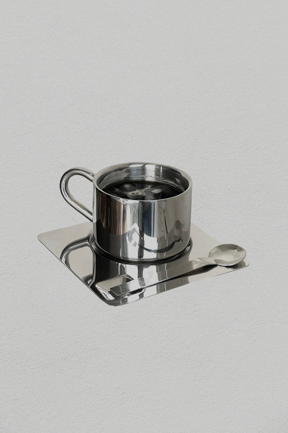 scandi stainless steel coffee mug with spoon and plate, detailed pictured with ice coffee