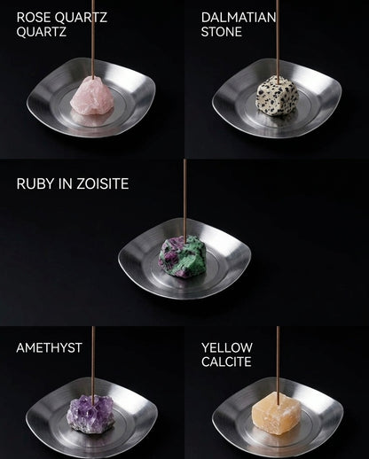 Collection of gemstones on stands with labels on a black background
